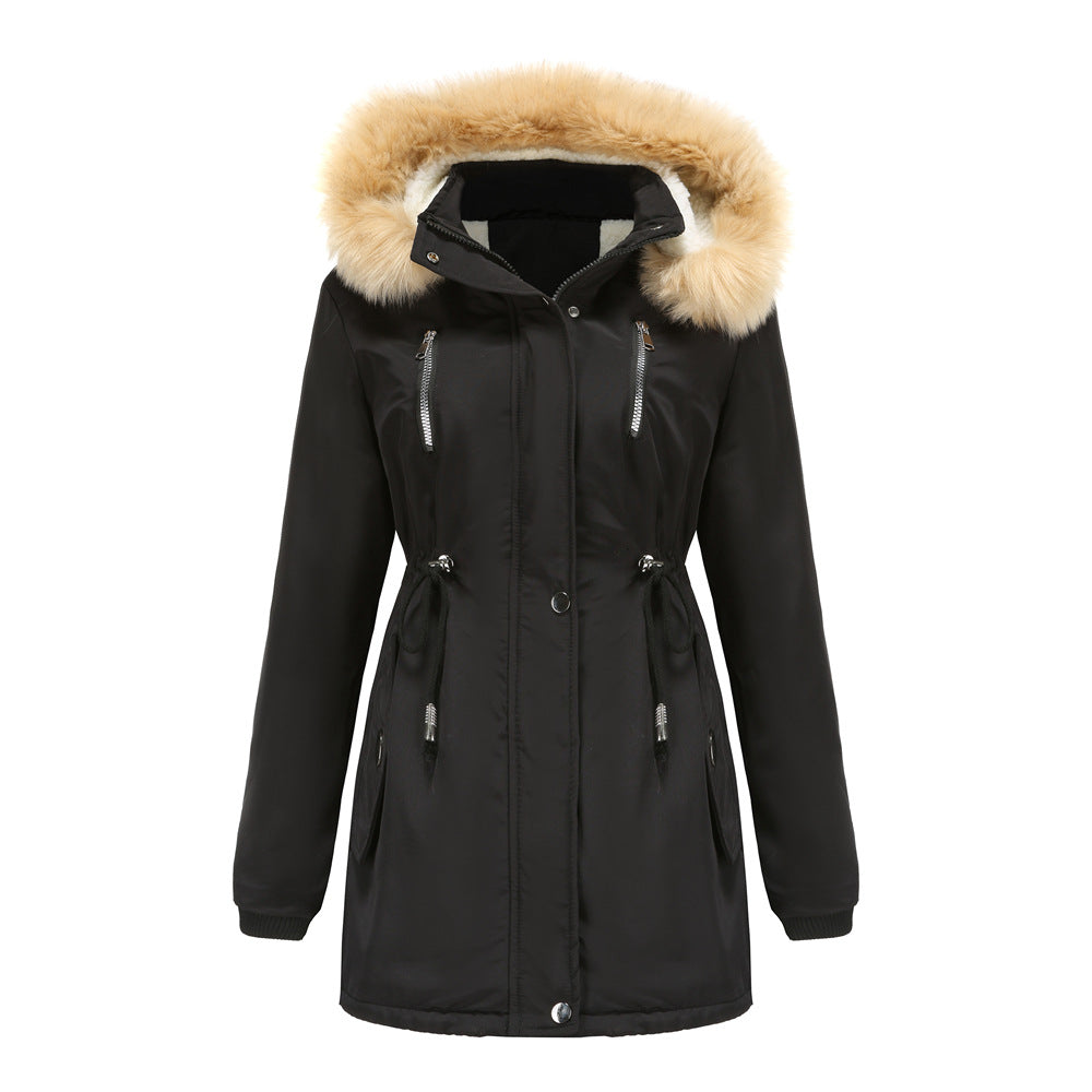 Woman wearing black hooded winter coat with faux wool collar