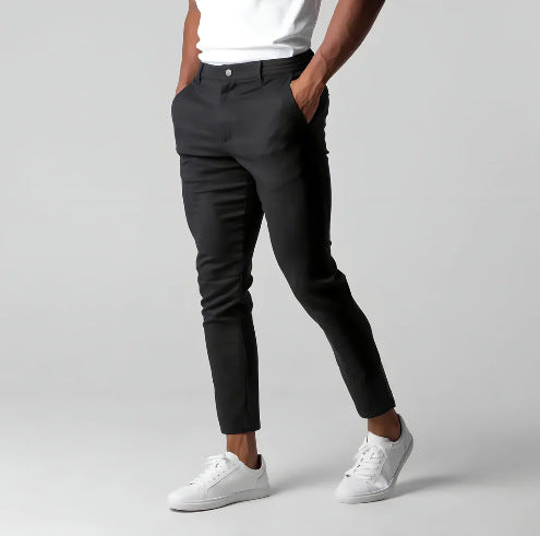 Man wearing slim straight business dress pants