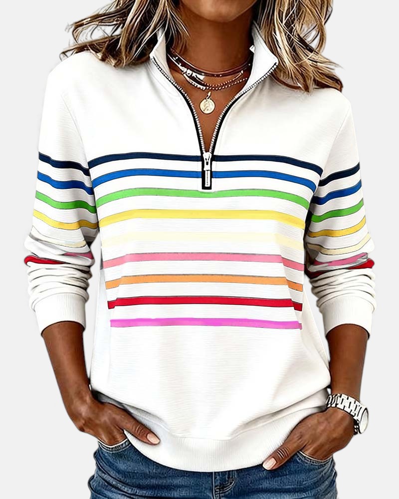 Woman wearing rainbow striped zip sweatshirt with stand collar