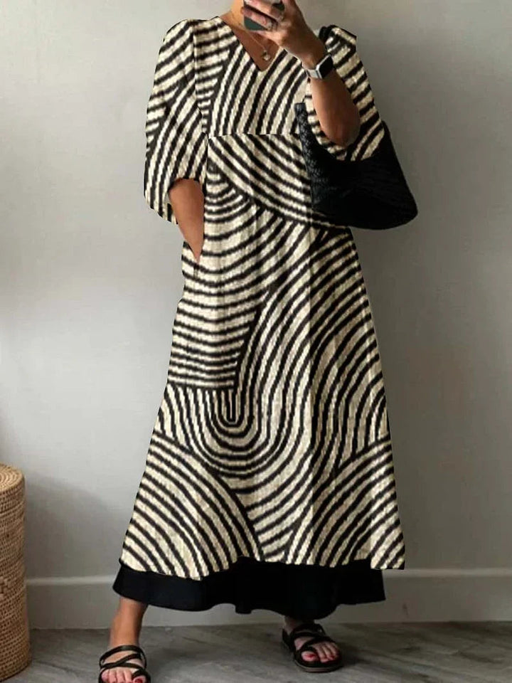 Woman wearing white and black geometric summer maxi dress