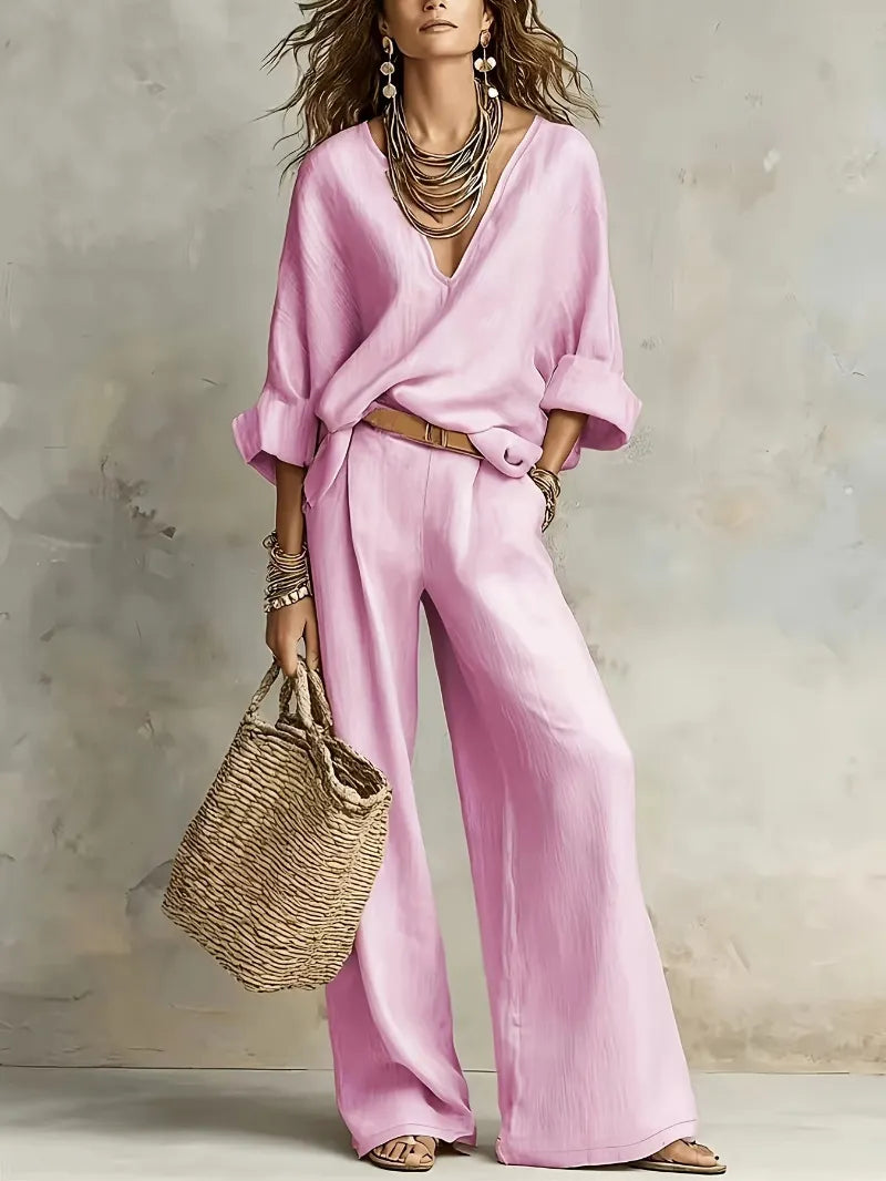 Woman wearing V-neck two piece set with wide leg pants