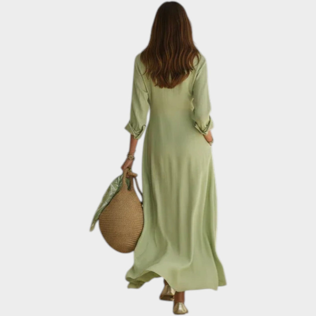 Woman wearing green button front maxi dress with long sleeves