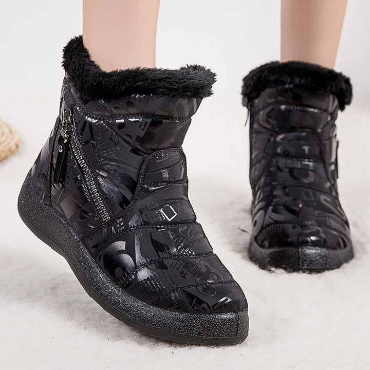 Woman wearing pink letter print plush-lined snow boots