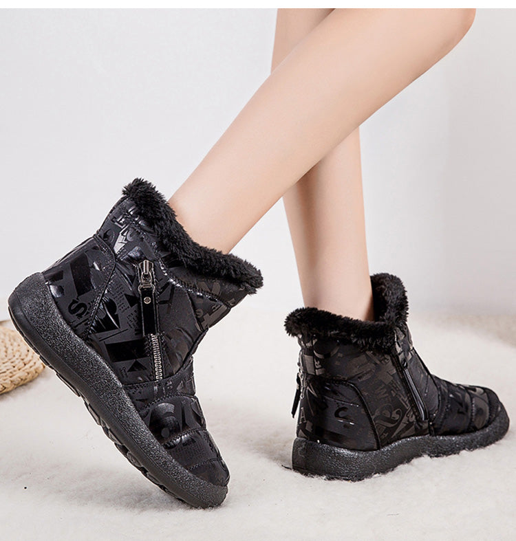 Woman wearing pink letter print plush-lined snow boots