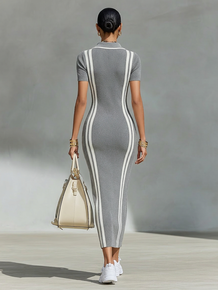 Woman wearing grey zip polo maxi dress with side stripes