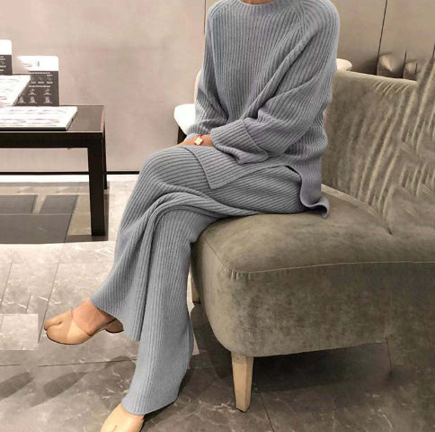 Woman wearing knit sweater top and wide-leg pants suit