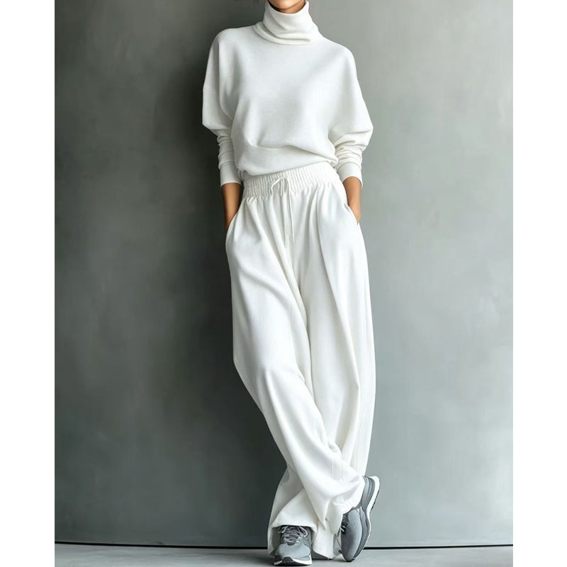 Woman wearing turtleneck two-piece set with wide-leg pants