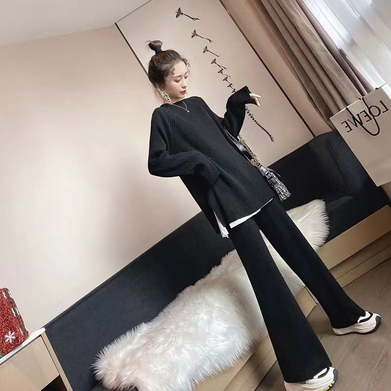 Woman wearing knit sweater top and wide-leg pants suit