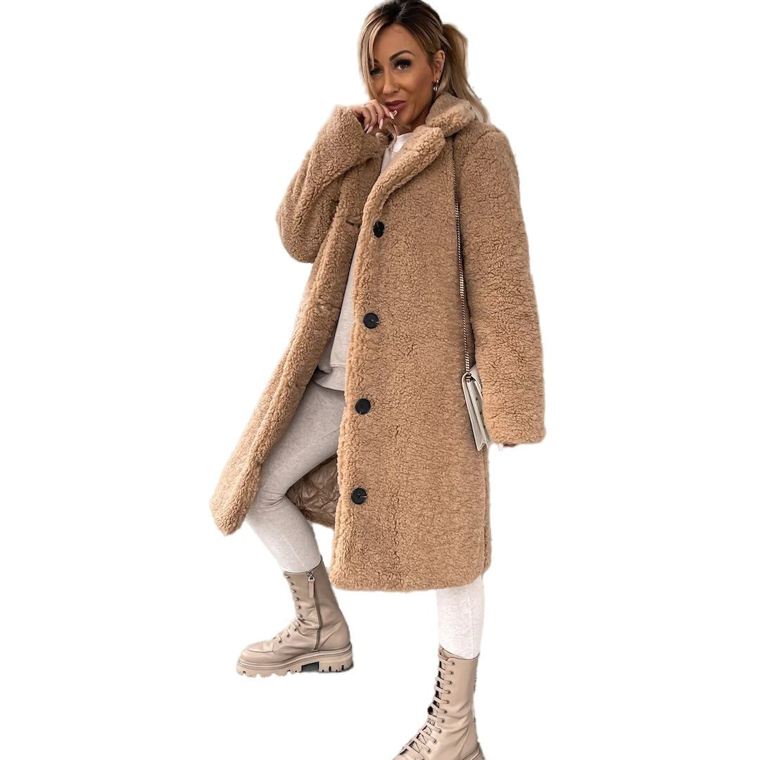 Woman wearing long lapel coat with fur collar
