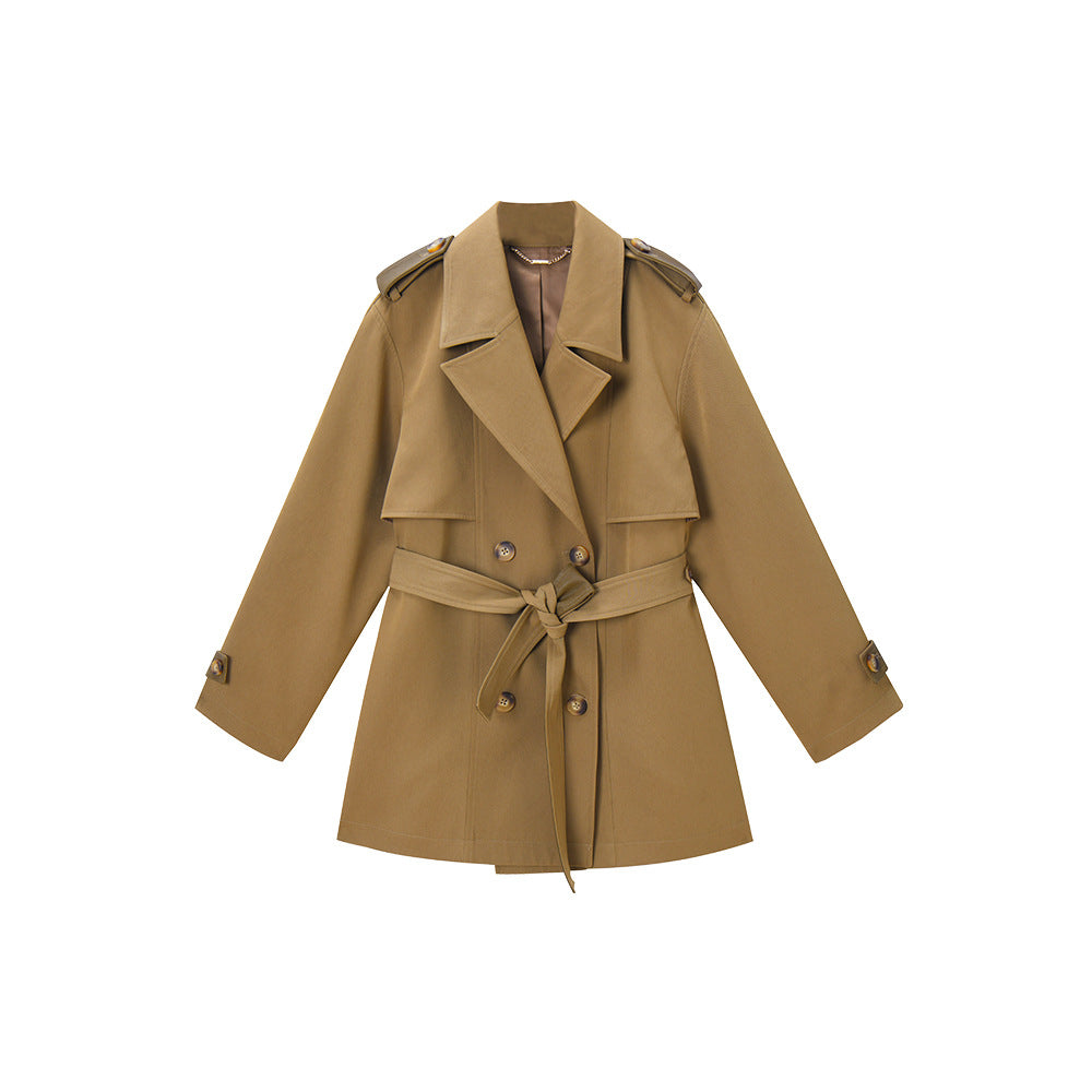 Woman wearing khaki short trench coat with long sleeves