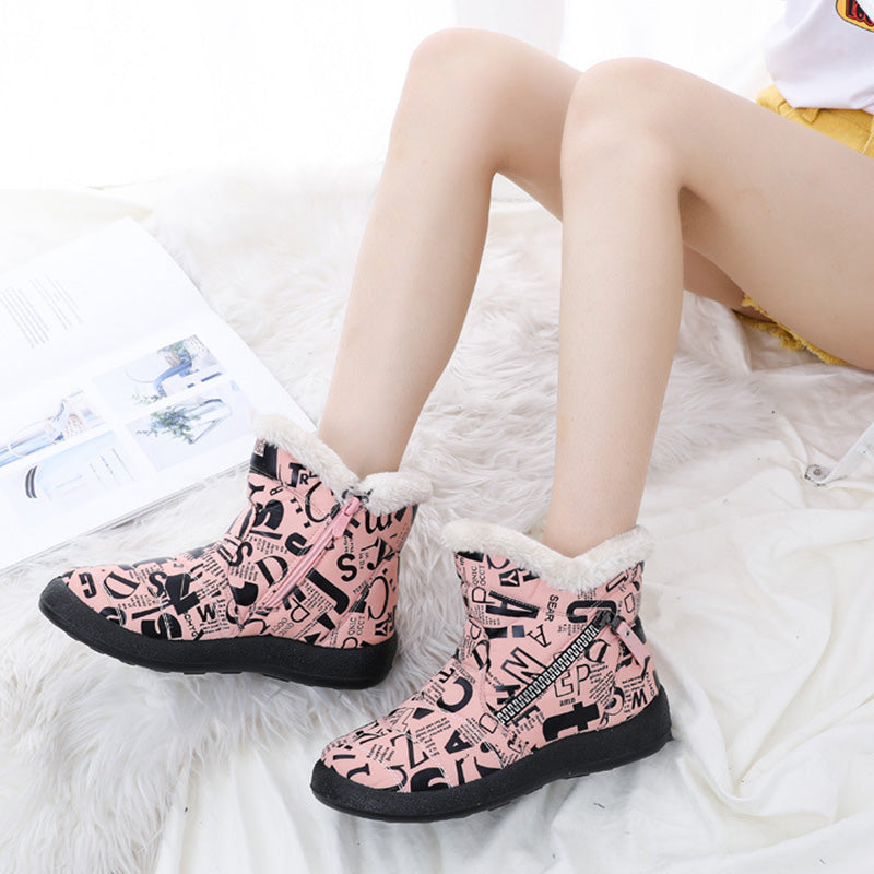 Woman wearing pink letter print plush-lined snow boots