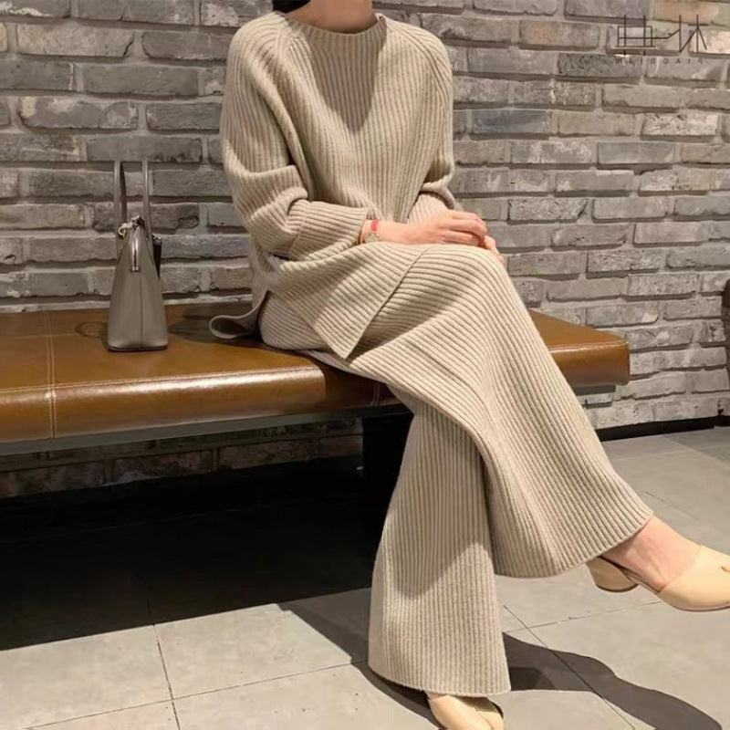 Woman wearing knit sweater top and wide-leg pants suit