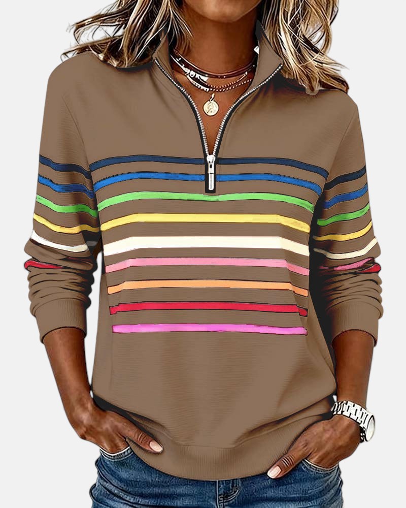 Woman wearing rainbow striped zip sweatshirt with stand collar