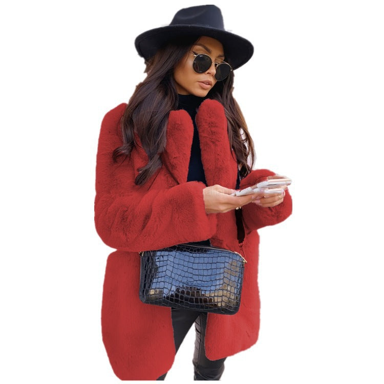 Woman wearing long faux fur coat with lapel collar