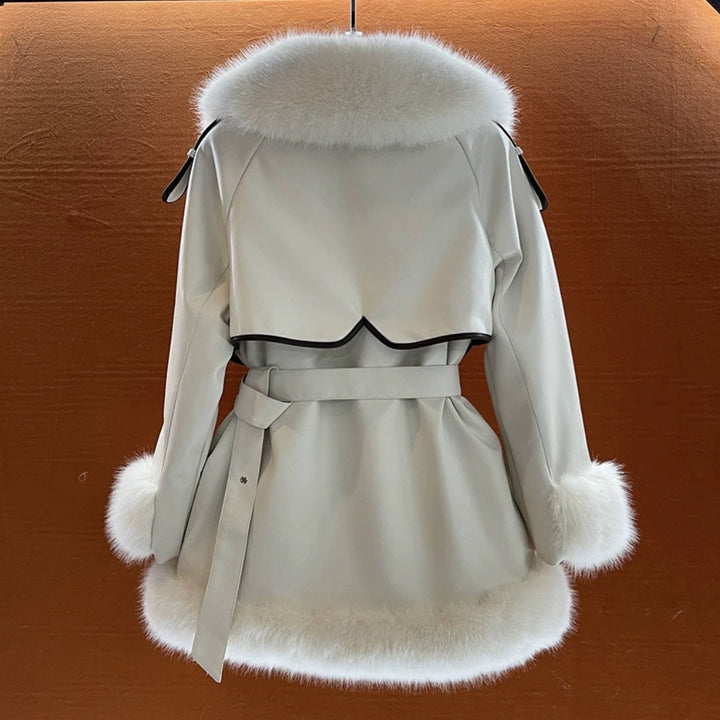 Woman wearing beige faux fur coat with fur collar