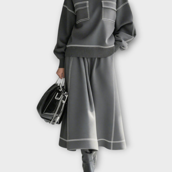 Woman wearing charcoal gray mock neck two-piece set