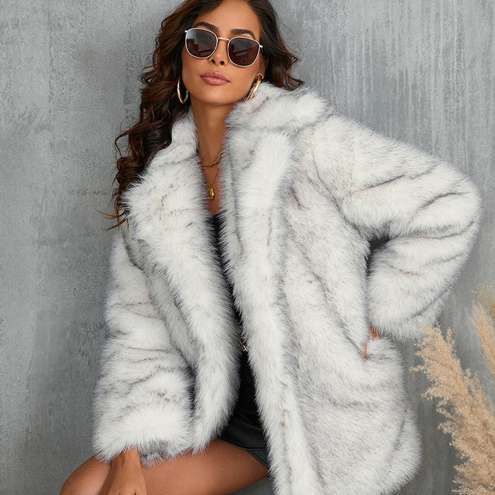 Woman wearing long faux fur coat with lapel collar