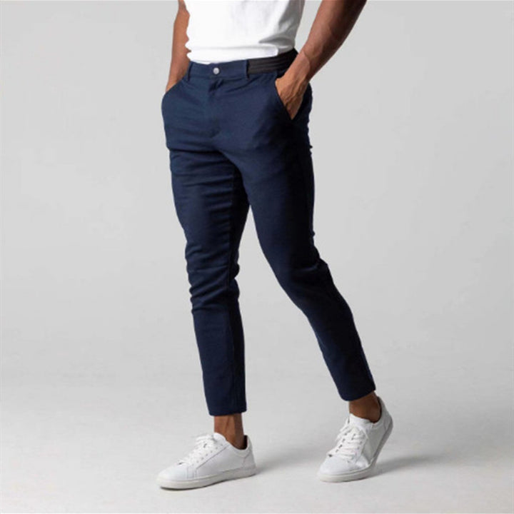 Man wearing slim straight business dress pants