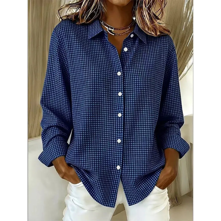 Woman wearing gingham button-up blouse with long sleeves