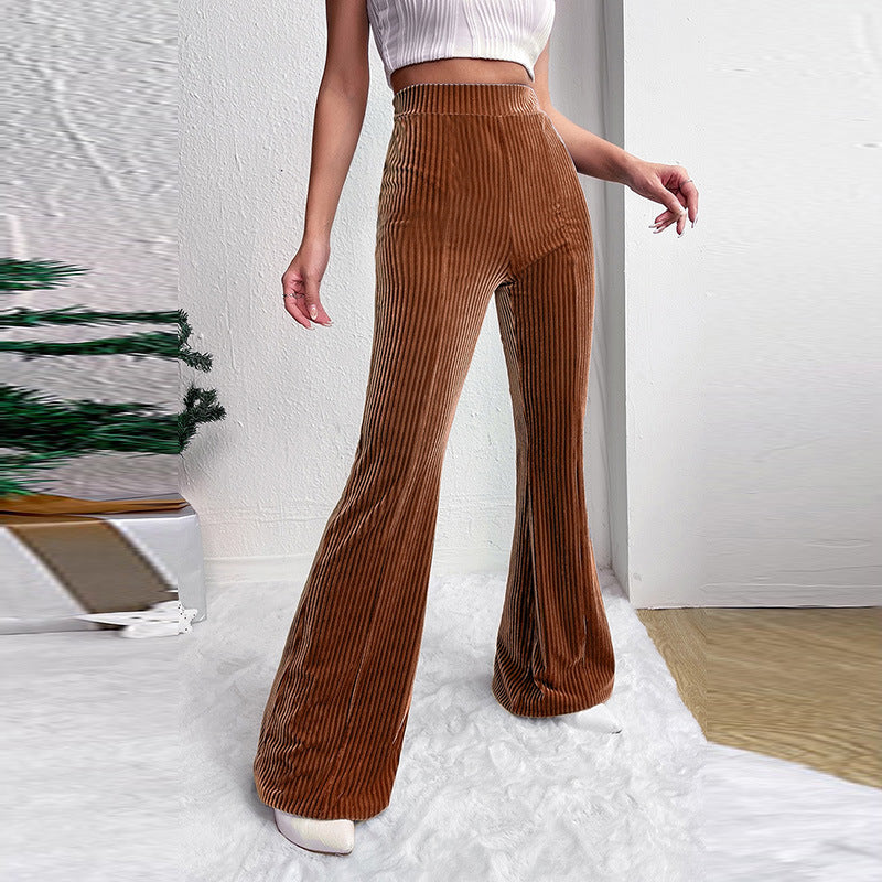 Woman wearing brown high waist corduroy wide leg pants