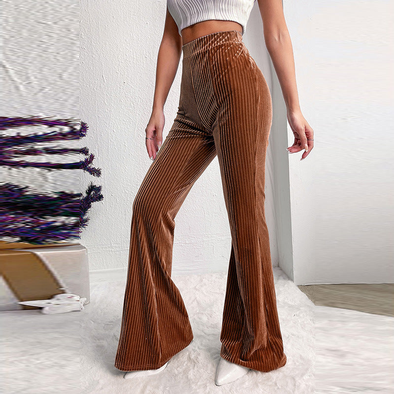 Woman wearing brown high waist corduroy wide leg pants