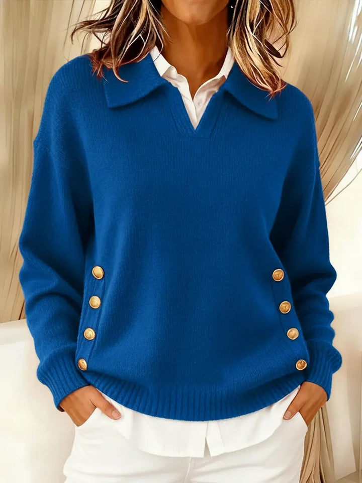 Woman wearing V-neck collared sweater with gold buttons