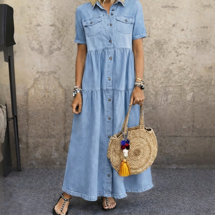 Woman wearing blue button-front midi dress with tiered skirt