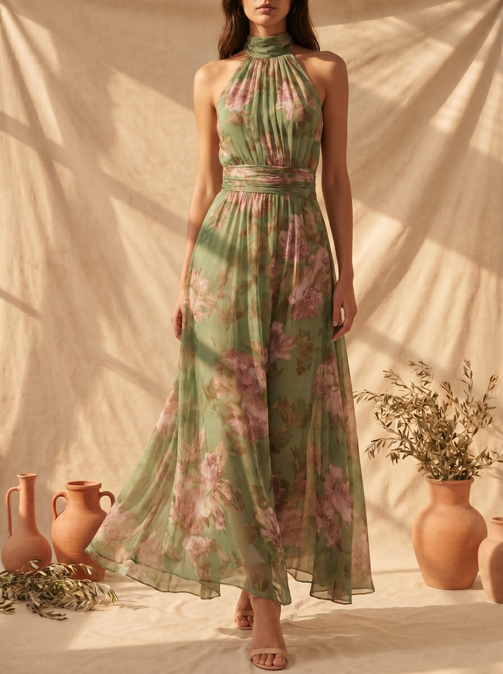 Woman wearing floral halter maxi dress with cinched waist