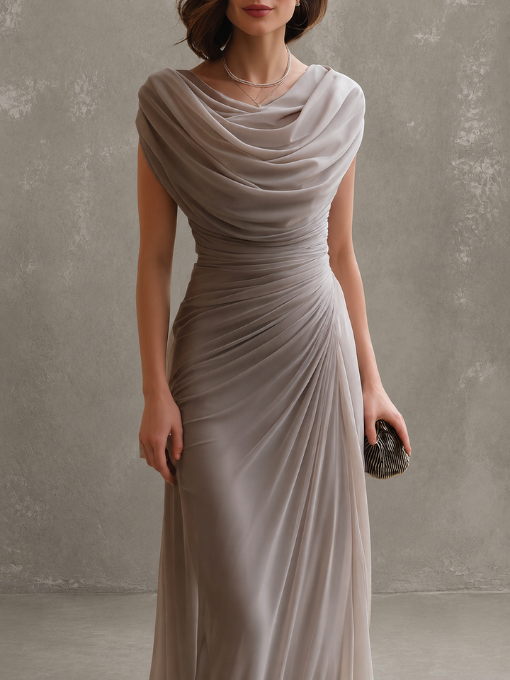 Woman wearing sleeveless draped maxi dress in full length