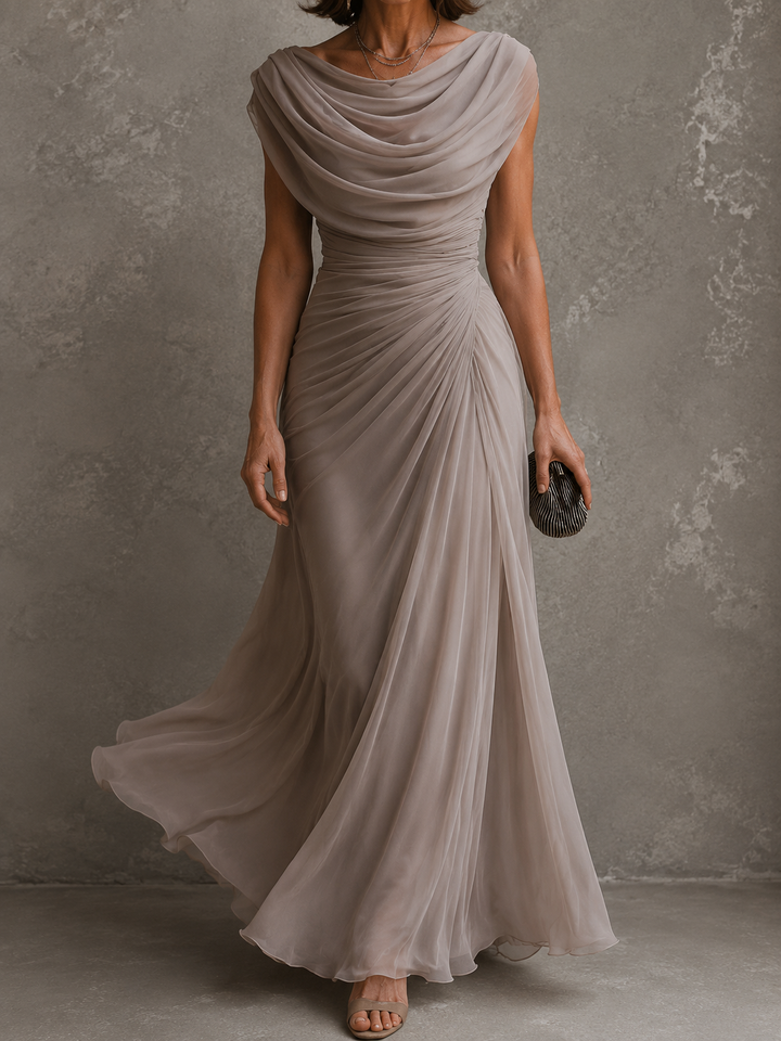 Woman wearing sleeveless draped maxi dress in full length