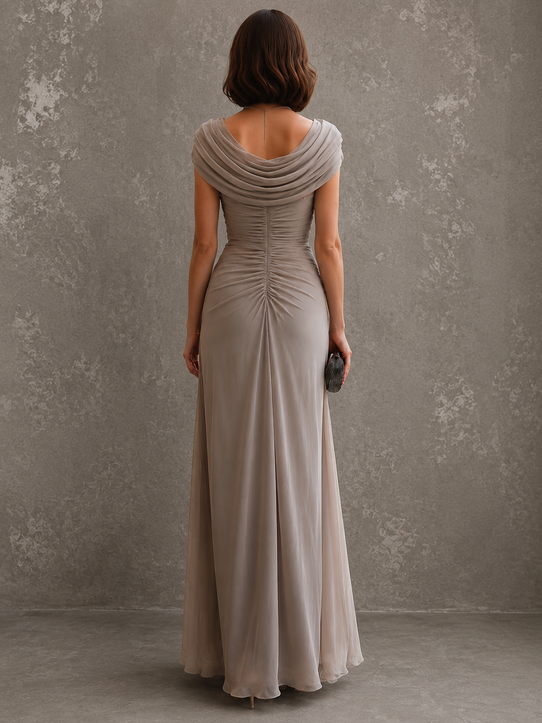 Woman wearing sleeveless draped maxi dress in full length