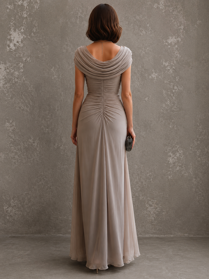 Woman wearing sleeveless draped maxi dress in full length