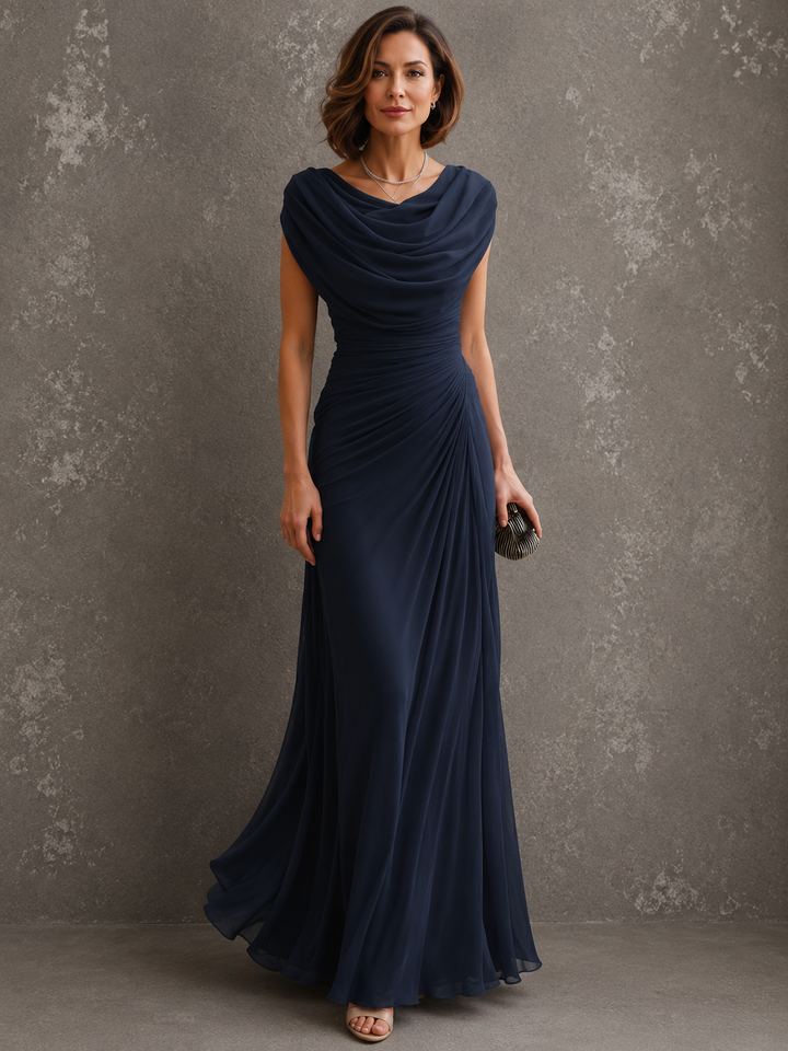 Woman wearing sleeveless draped maxi dress in full length