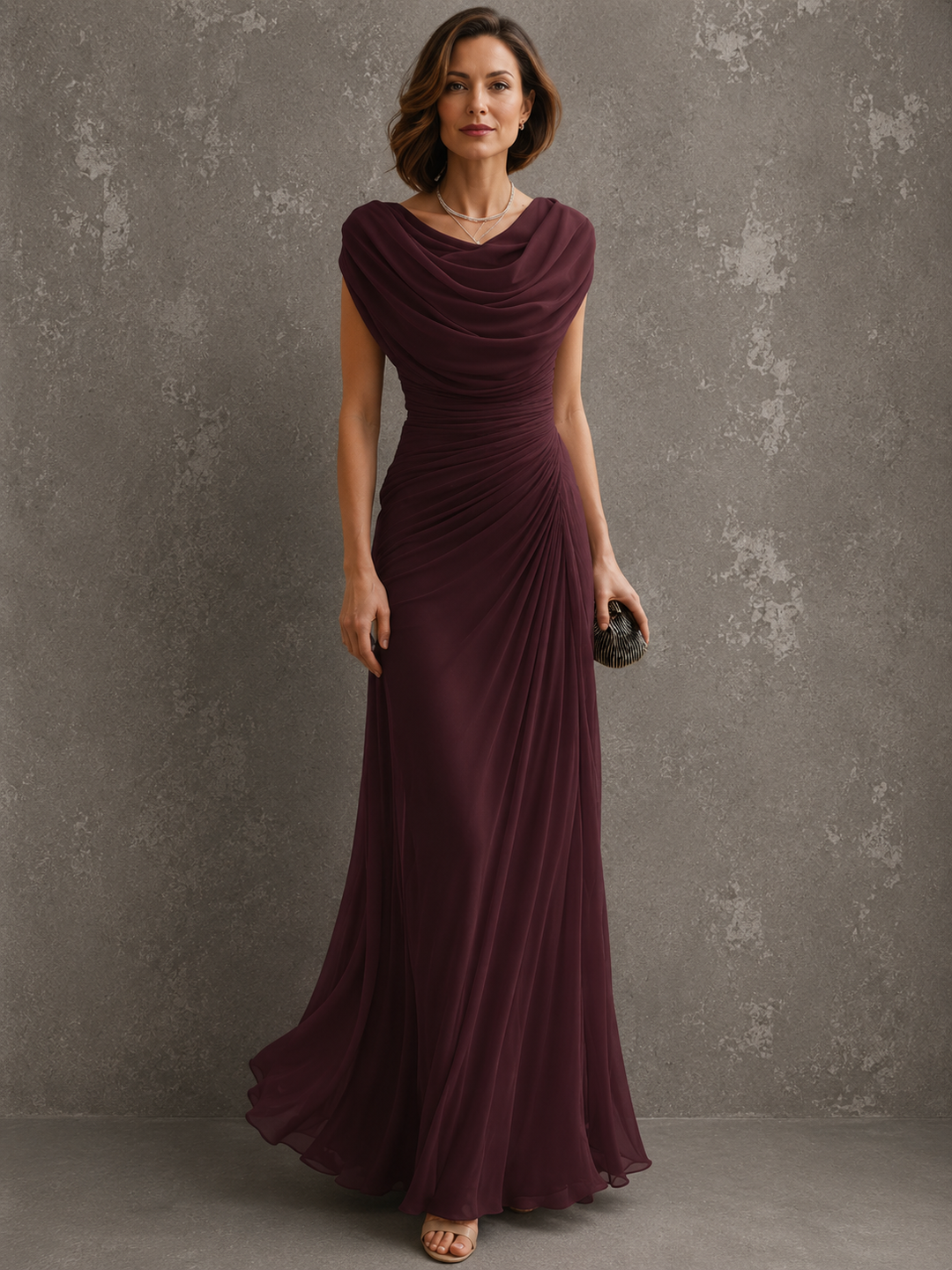 Woman wearing sleeveless draped maxi dress in full length