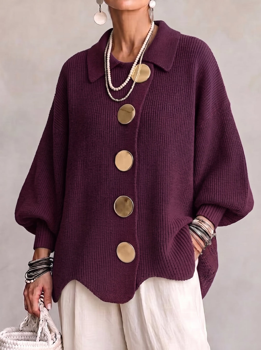 Woman wearing oversized cardigan with lantern sleeves