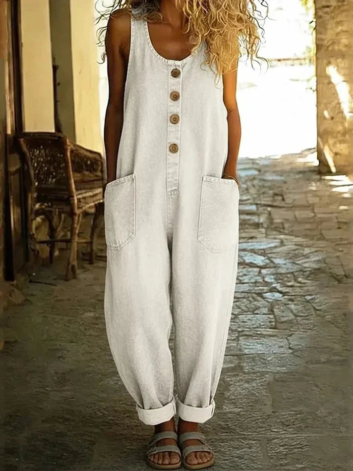 Woman wearing a wide leg jumpsuit with adjustable straps