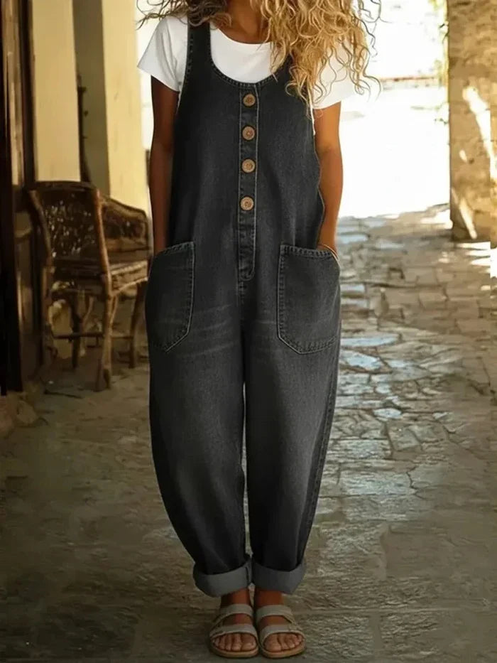 Woman wearing a wide leg jumpsuit with adjustable straps