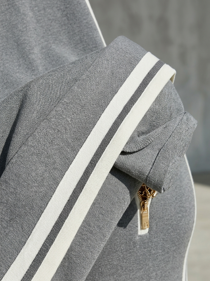 Woman wearing grey zip polo maxi dress with side stripes